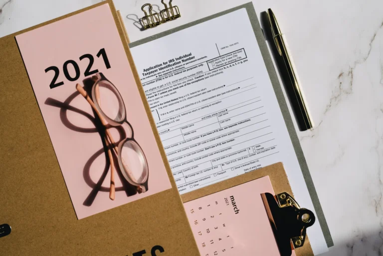 Tax forms and financial planning documents laid out on a desk, representing 2027 tax bracket planning