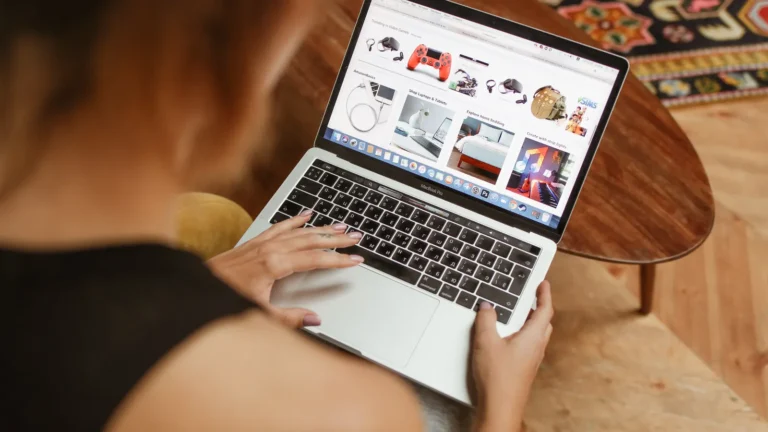 Woman shopping online on a laptop at home