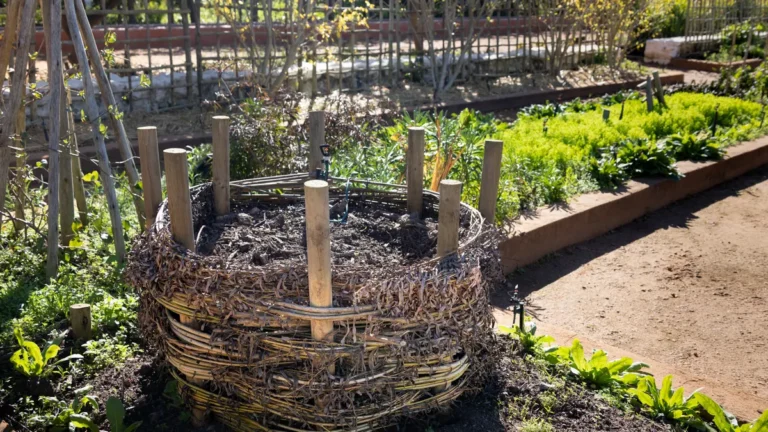 Woven compost bin filled with organic waste in a home garden