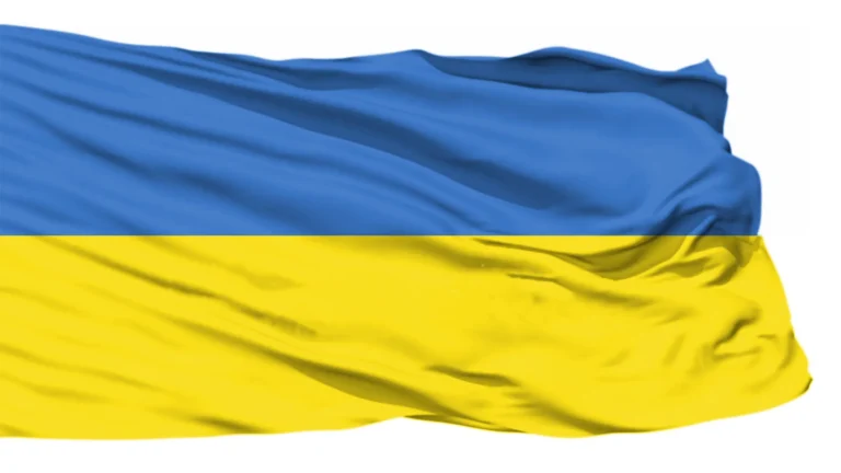 Ukrainian flag flying against a blue sky