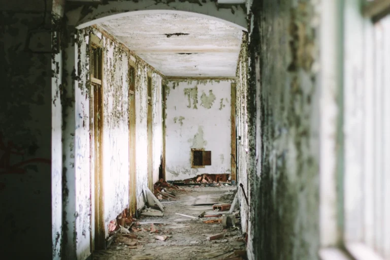 Eerie abandoned hallway evoking the outbreak setting of the Resident Evil 2026 movie