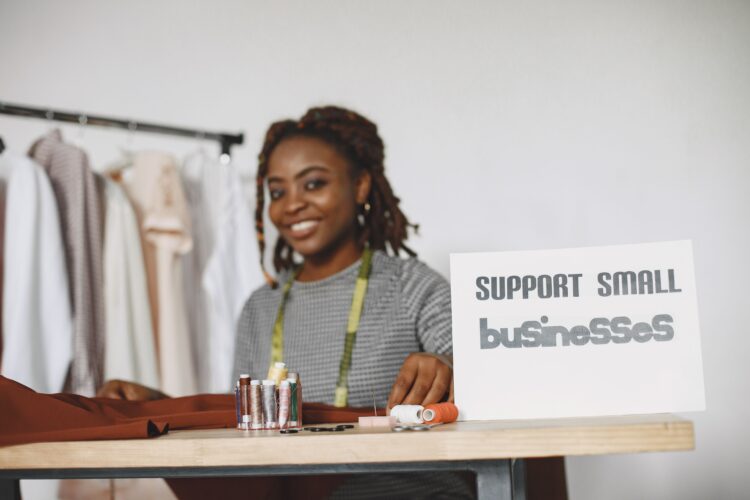 Small business owner working in her studio, supporting small businesses in 2026