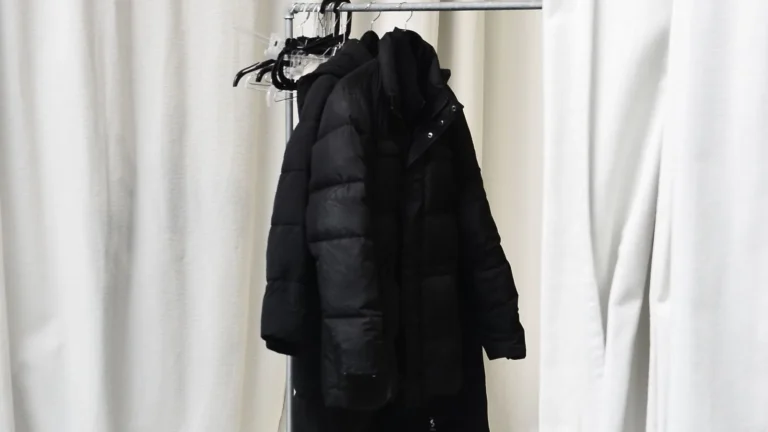 Winter coats and jackets hanging on a clothing rack