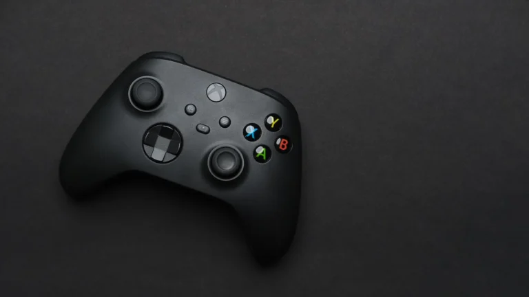 Black video game controller on a dark background