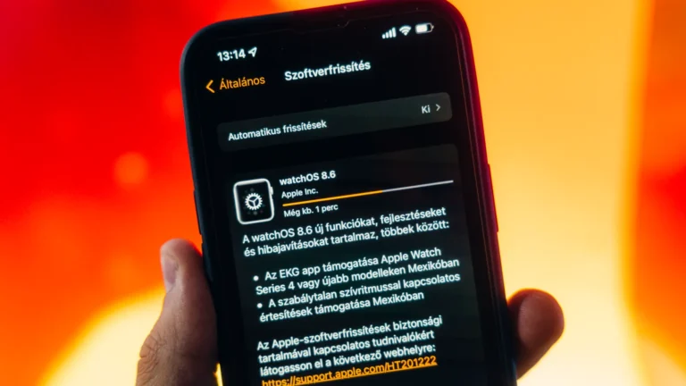 Person holding a smartphone that is installing a software update