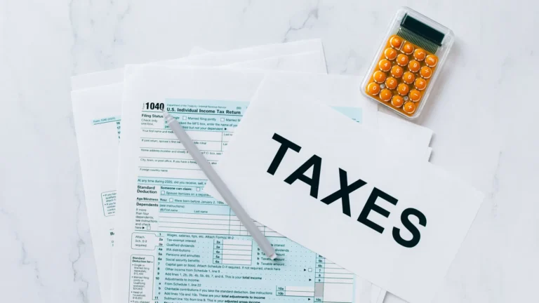 Tax documents and forms spread out on a table