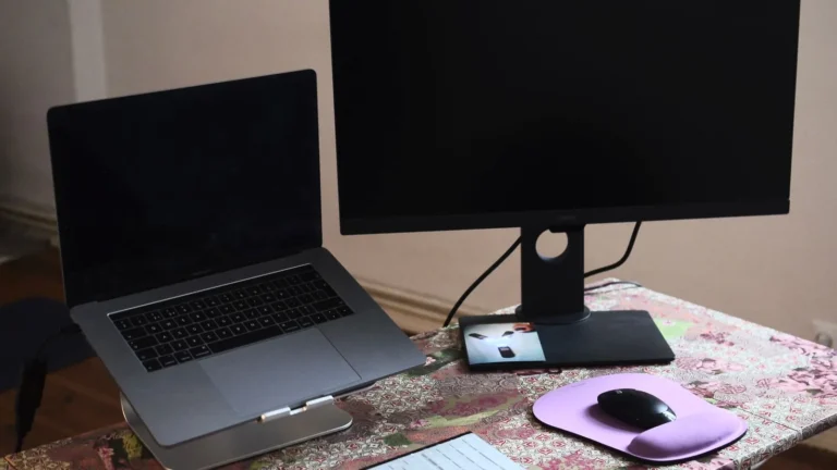 Laptop and monitor on a desk in a home office
